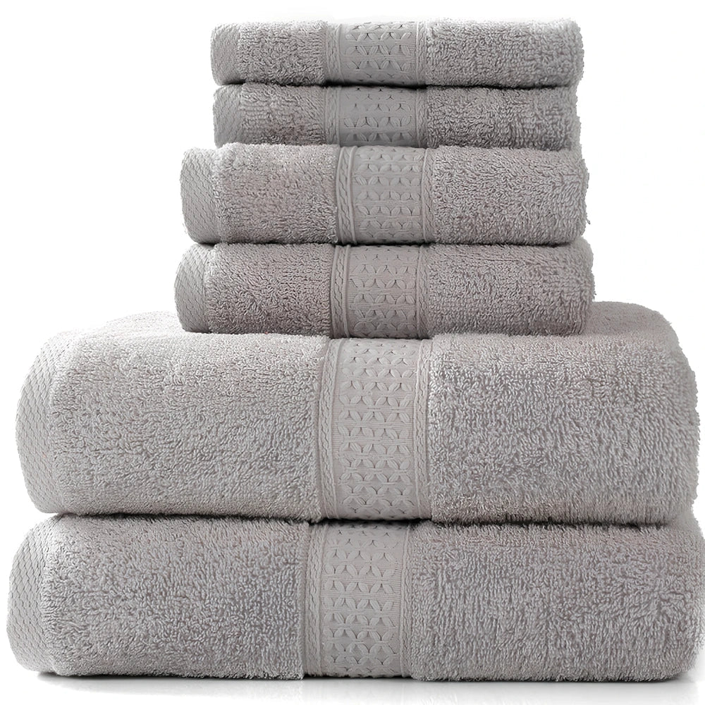 Cotton towel set showing bath towel, hand towel, and face cloth in coordinated sizes