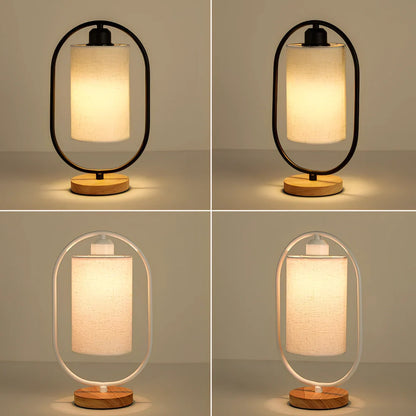 Black metal bedside lamp with dimming button and 5W LED warm light on wooden table