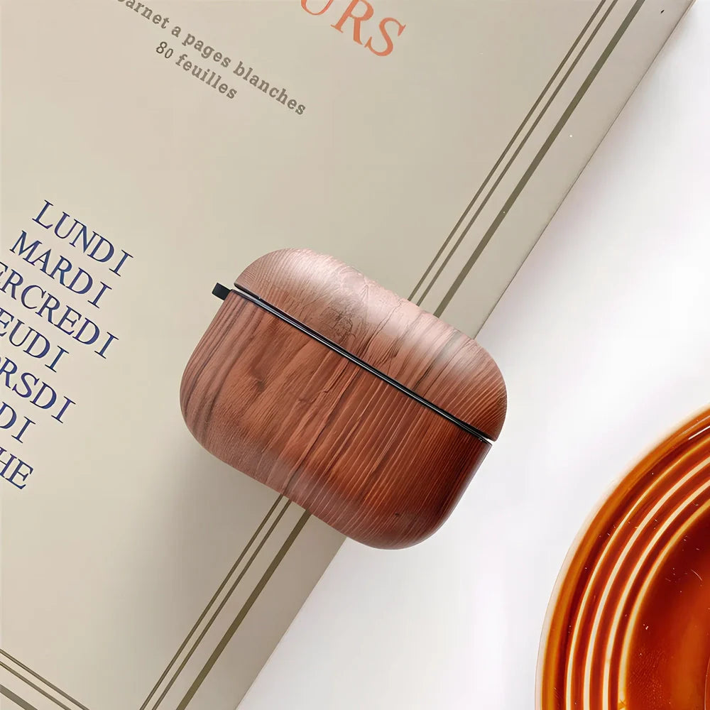 Wood grain AirPods case with IMD clamshell design showing six colour options including dark brown and red brown patterns