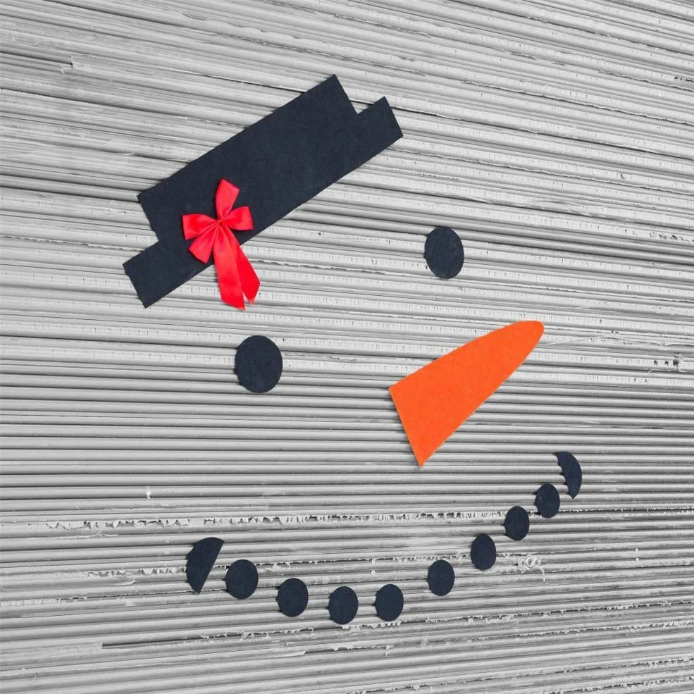 DIY snowman decoration kit with 16 components including hat, bow, and foam shapes on non-woven fabric