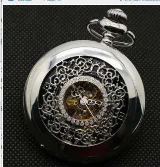 Retro automatic pocket watch with floral print dial and transparent case back showing mechanical movement.