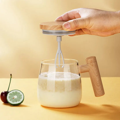 Clear borosilicate glass self-stirring coffee mug with 400ml capacity and electric mixing button