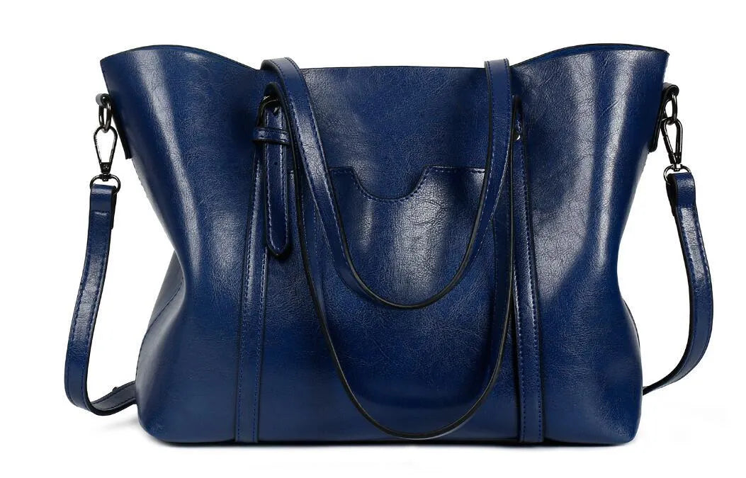 Retro messenger bag showing 31cm length, A4 magazine capacity, available in eight colours including wine red and light blue
