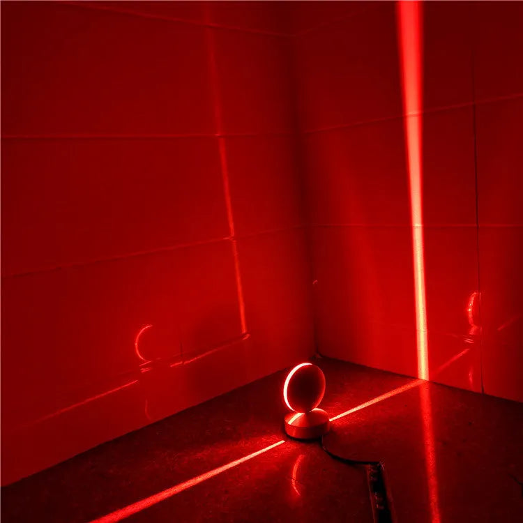 Aluminium and glass LED wall spotlight bar with colour change options, mounted on a corridor wall.