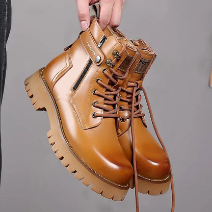 Men's light brown high-top Martin boots with side zipper and thick rubber sole on a wooden floor