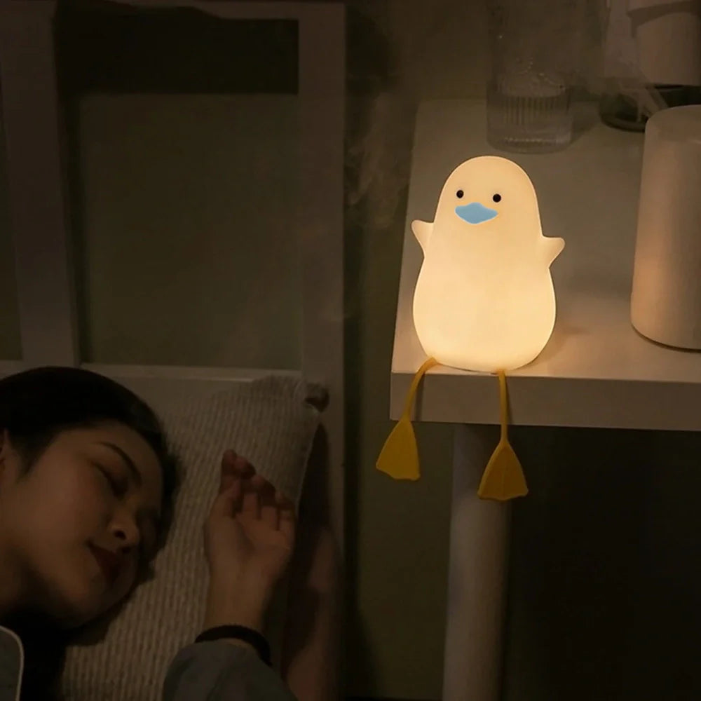 Seagull-shaped silicone night light in blue or yellow measuring 96.5×91×130mm with tap controls