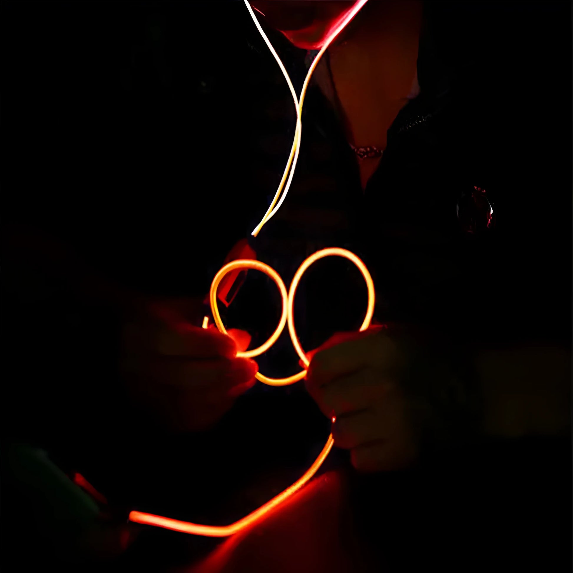 Blue Magic Light LED earphones with aluminium alloy shells and glowing EL lights, connected to a 3.5mm plug