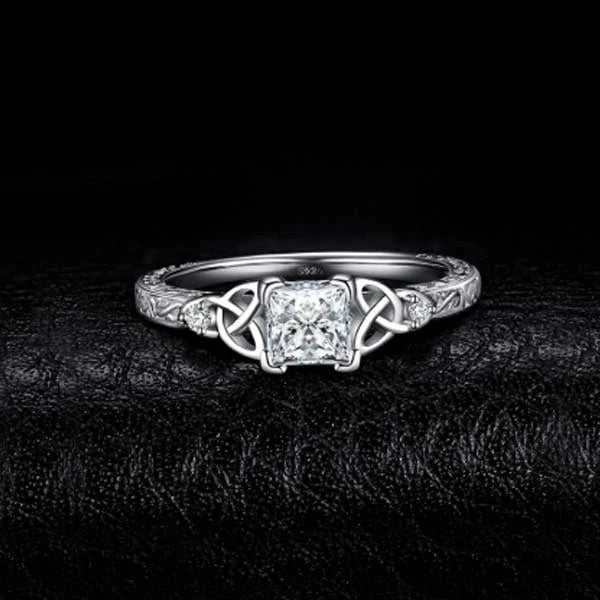 Elegant crystal engagement ring with constellation-inspired design and sparkling white steel accents