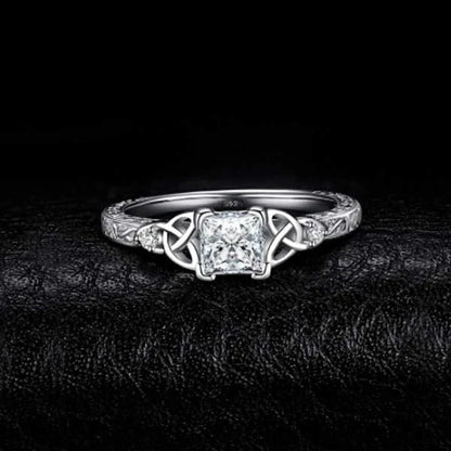 Elegant crystal engagement ring with constellation-inspired design and sparkling white steel accents