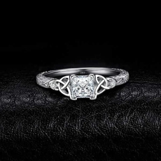 Elegant crystal engagement ring with constellation-inspired design and sparkling white steel accents