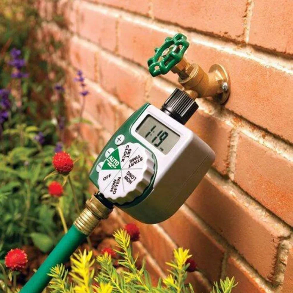 Green garden irrigation controller with LCD display and rotating dial for programming watering schedules
