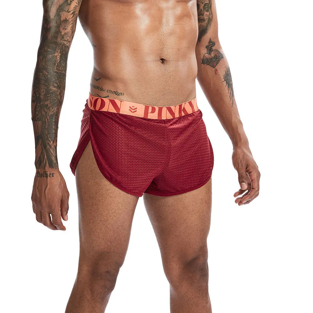 Breathable mesh men's boxer briefs in black, shown laid flat