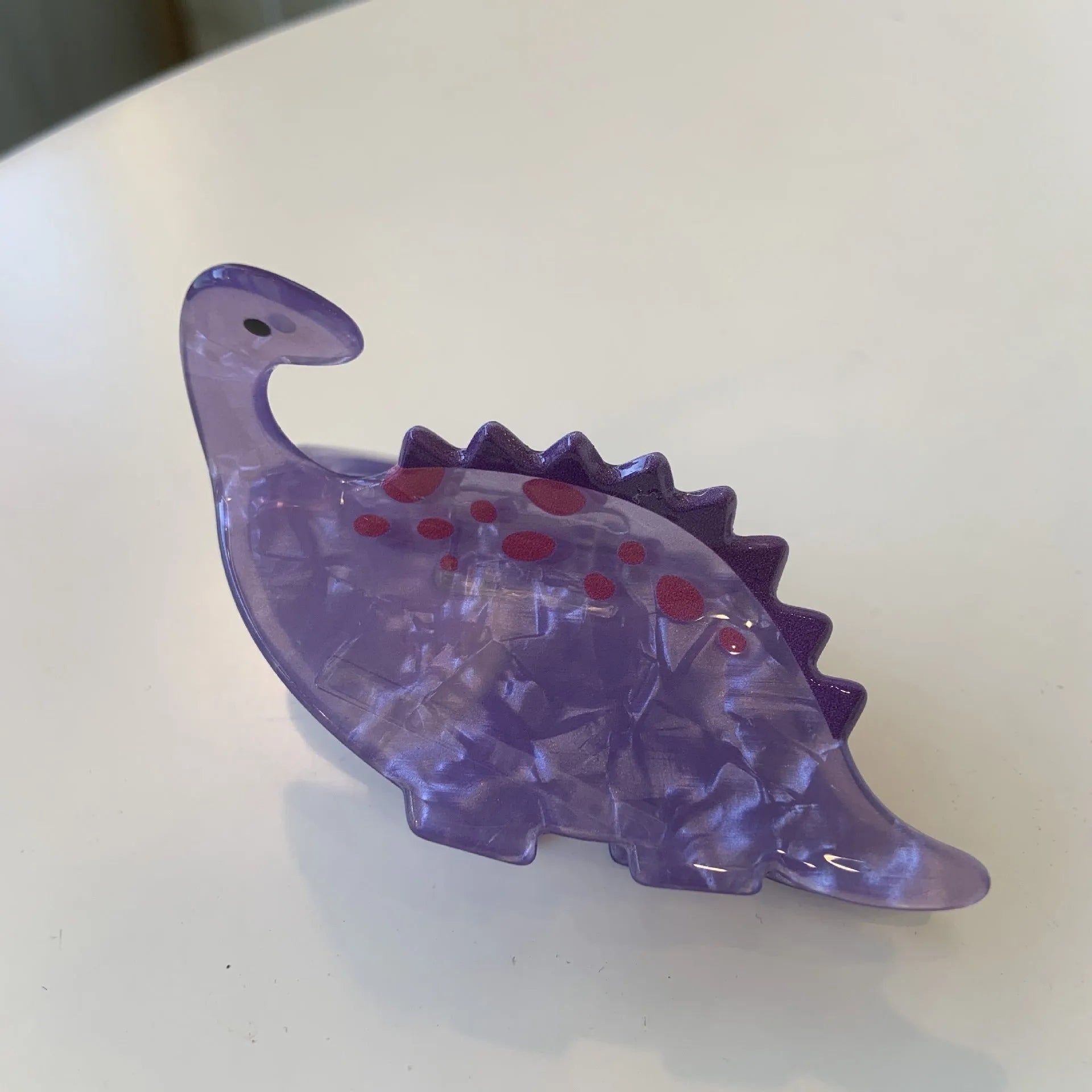 Acrylic dinosaur jaw clip hairpin showing six colour variations: pink, green, purple, blue, brown