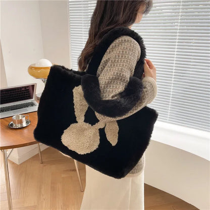 Cute cartoon rabbit ears design on a soft plush large capacity shoulder tote bag.
