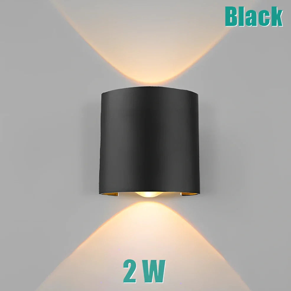 Waterproof black aluminium LED wall lamp 4W warm white emitting 60-degree beam angle mounted on white wall