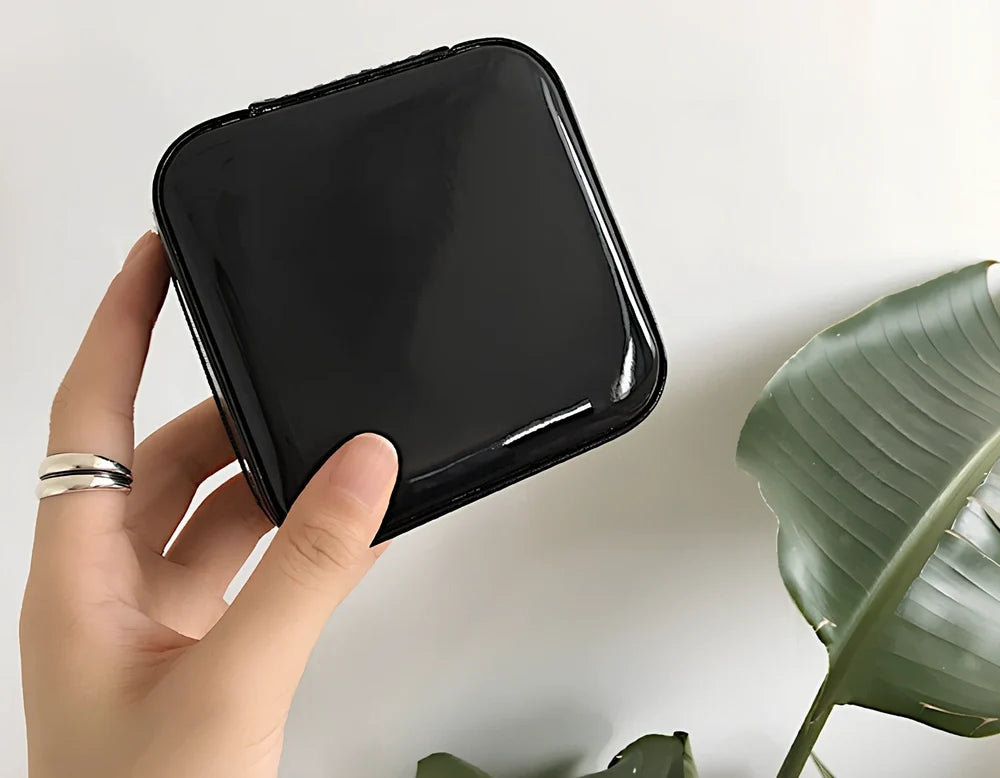 Three-layer travel jewellery box with PU leather exterior and secure closure for organised accessory storage