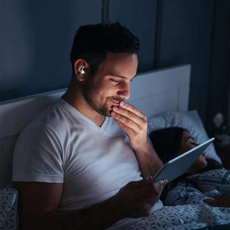 Silicone anti-noise sleep earplugs in grey and black, featuring shark fin design for secure fit