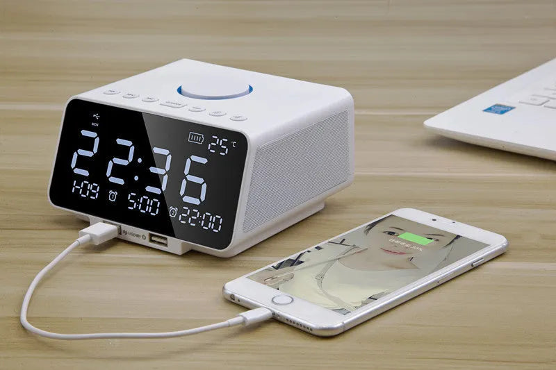 Black wireless alarm clock speaker with dual speakers, display, and control buttons