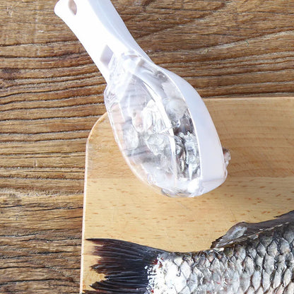 Fish scaler with fish-shaped handle and integrated scale cover for kitchen fish preparation