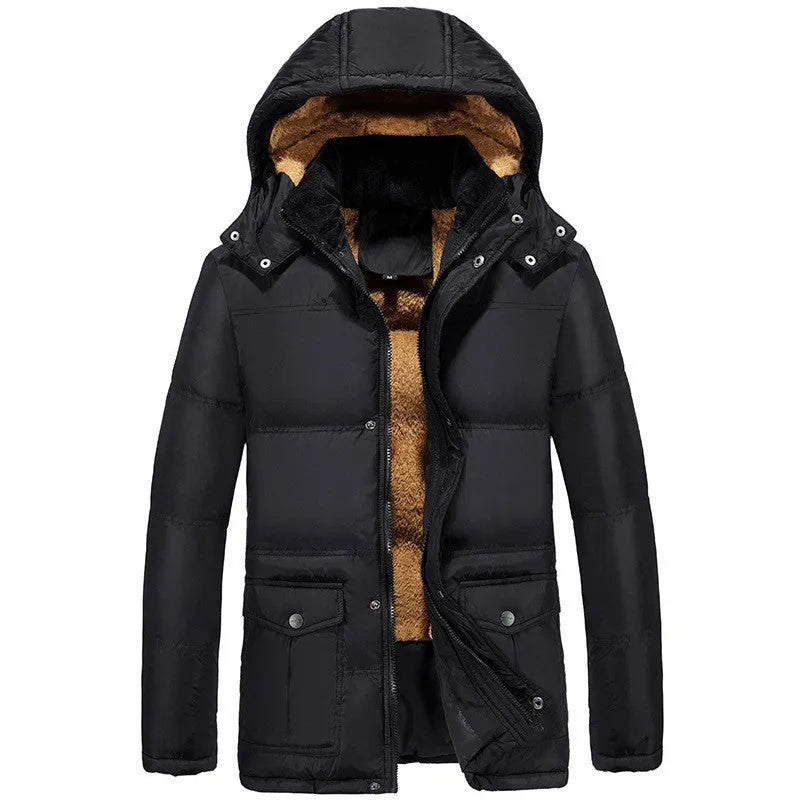 Man wearing a black velvet double-breasted padded winter jacket with a hood.
