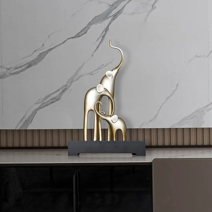 Fortune Bring Elephant resin decorative figurine in gold finish, 15cm tall on a wooden surface.