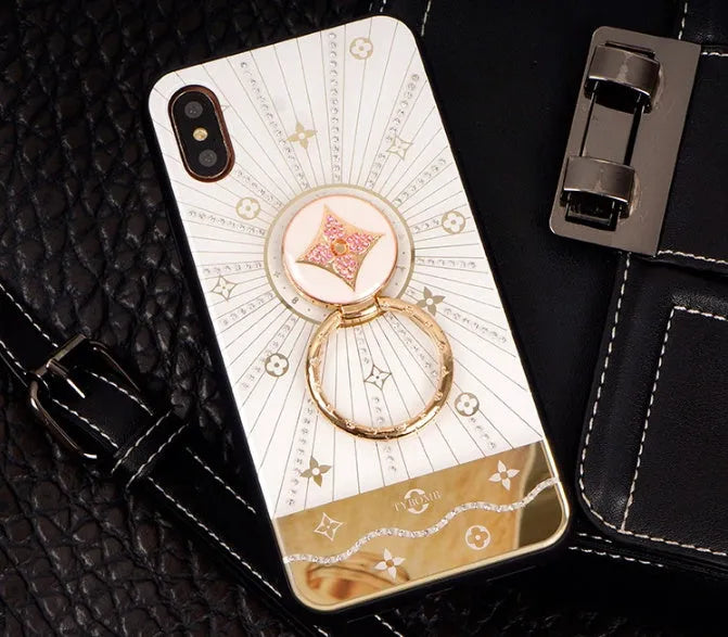 Gold-plated iPhone ring stand holder adorned with luxury diamond crystals, shown in rose gold and white gold colours.