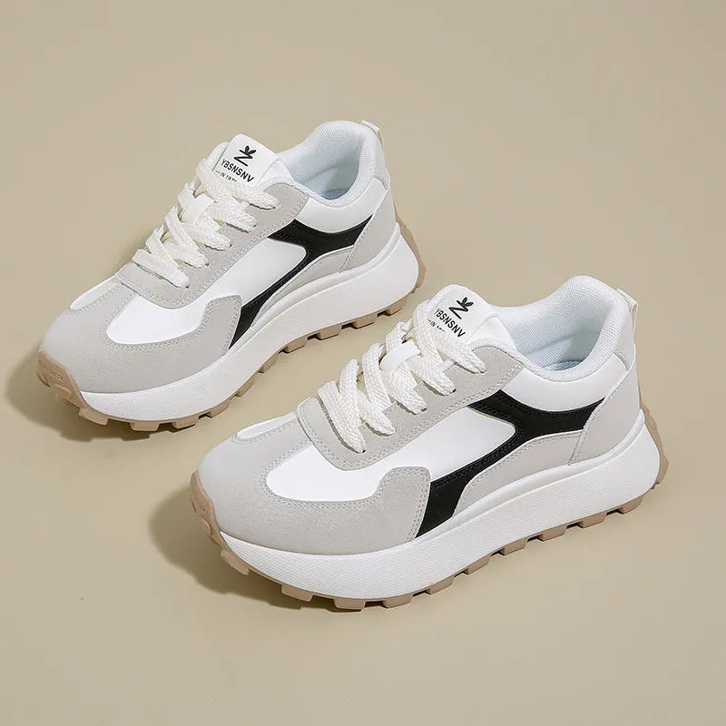 Women's solid colour low-top sports shoes with flat platform sole and lace-up front.