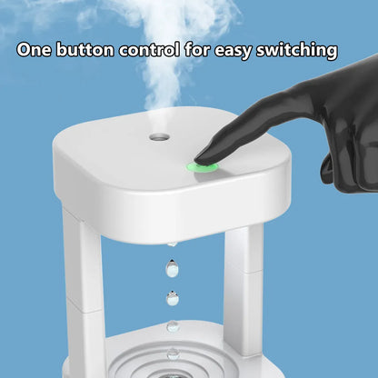 Creative anti-gravity water drop humidifier with upward flowing droplets and coloured lights