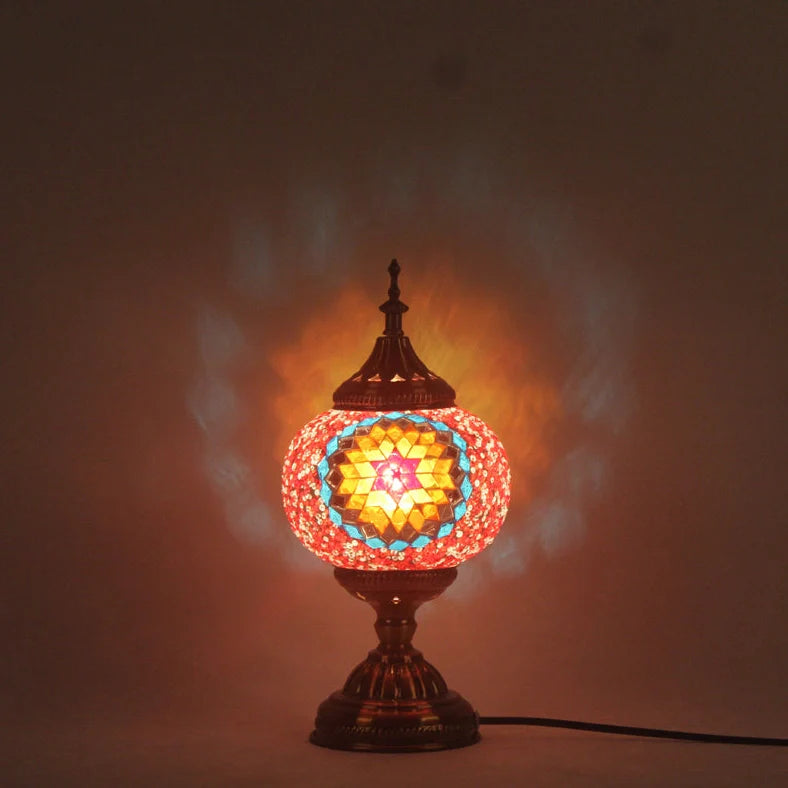 Glass table lamp with 150mm diameter shade and 330cm cord on wooden surface