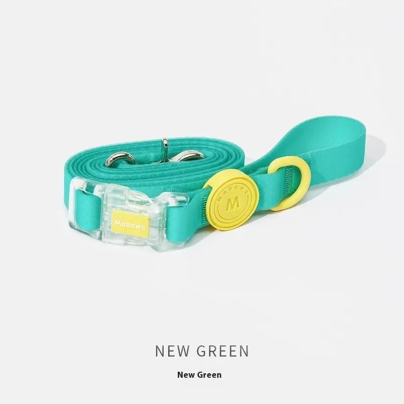 Nylon dog collar and hand holding rope in smoky gray, new green, lemon yellow, and rose pink colour options.