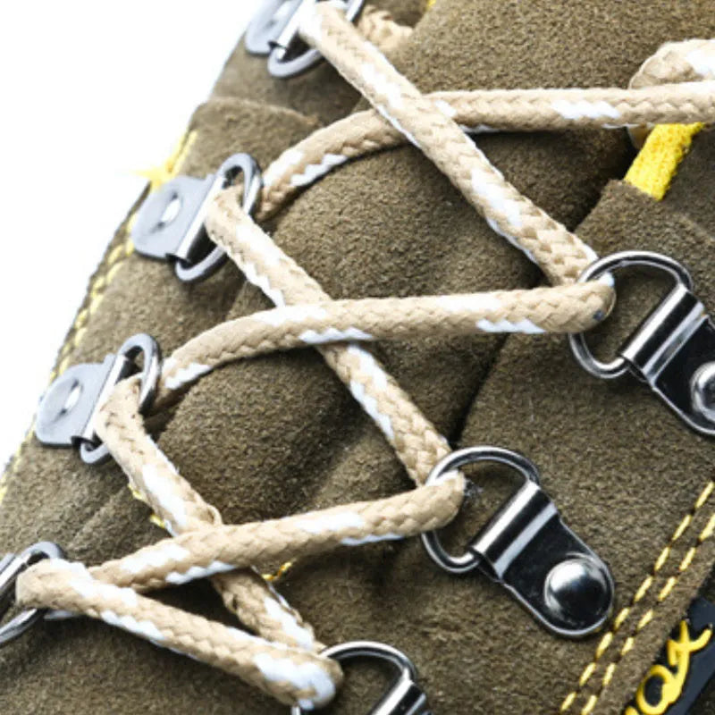 Bronze low-cut leather safety shoes with steel toe cap and patterned non-slip rubber sole.
