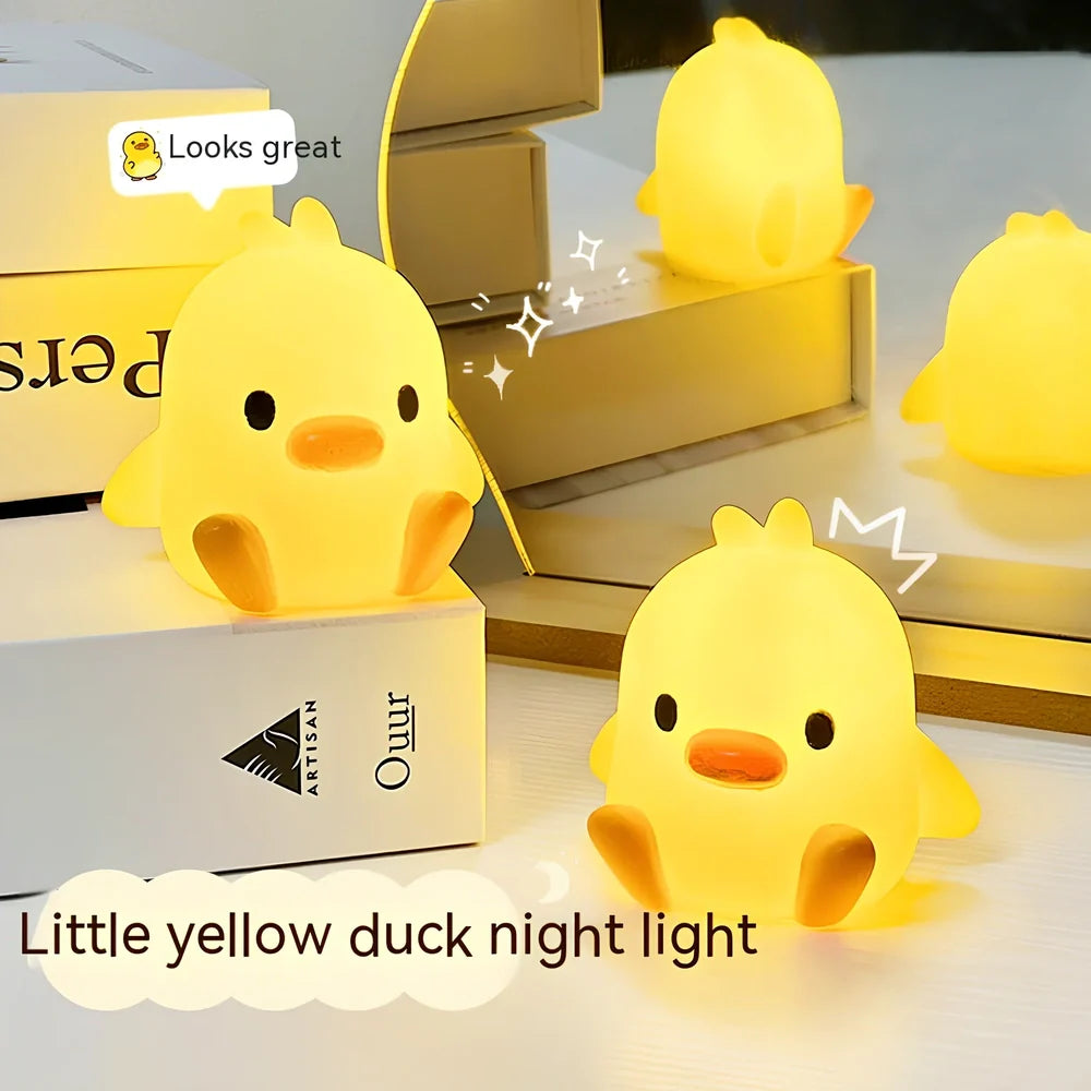 Small yellow duck-shaped night lamp measuring 6cm tall with warm LED light