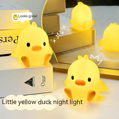 Small yellow duck-shaped night lamp measuring 6cm tall with warm LED light