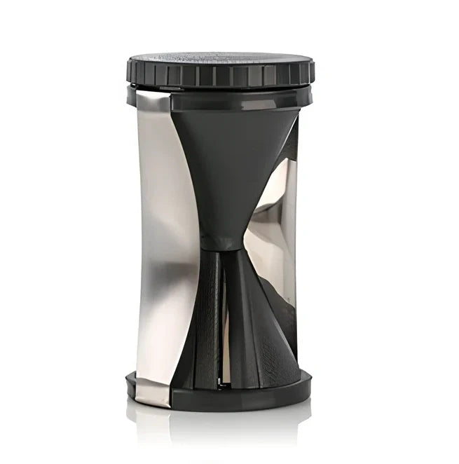 White spiral vegetable slicer with stainless steel blades on kitchen counter with zucchini noodles