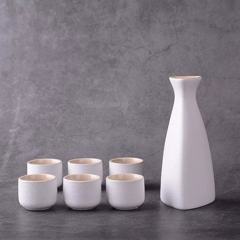 Sakura vintage sake set with ceramic kettle, wine glass, and triangle pot in traditional Japanese design