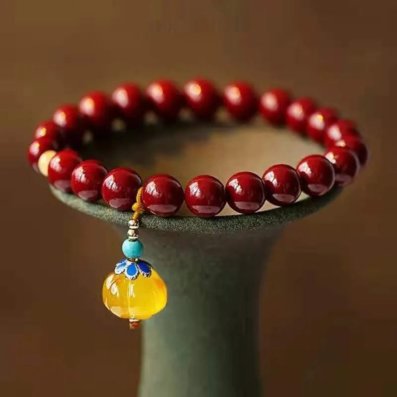 Handmade gold cinnabar wave bracelet with copper beads in national style.