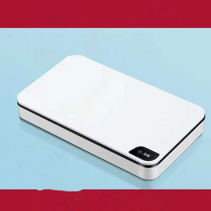 White multifunctional wireless phone charger and ultraviolet air steriliser unit with remote control.