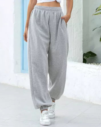 Plus-size slacks in black, grey, and green with elastic waistband