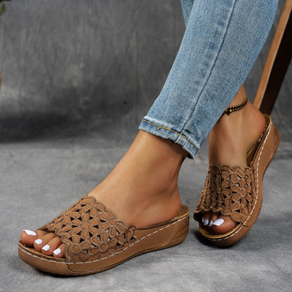 Women's black wedge beach slippers with flower cutout decoration on the PVC upper
