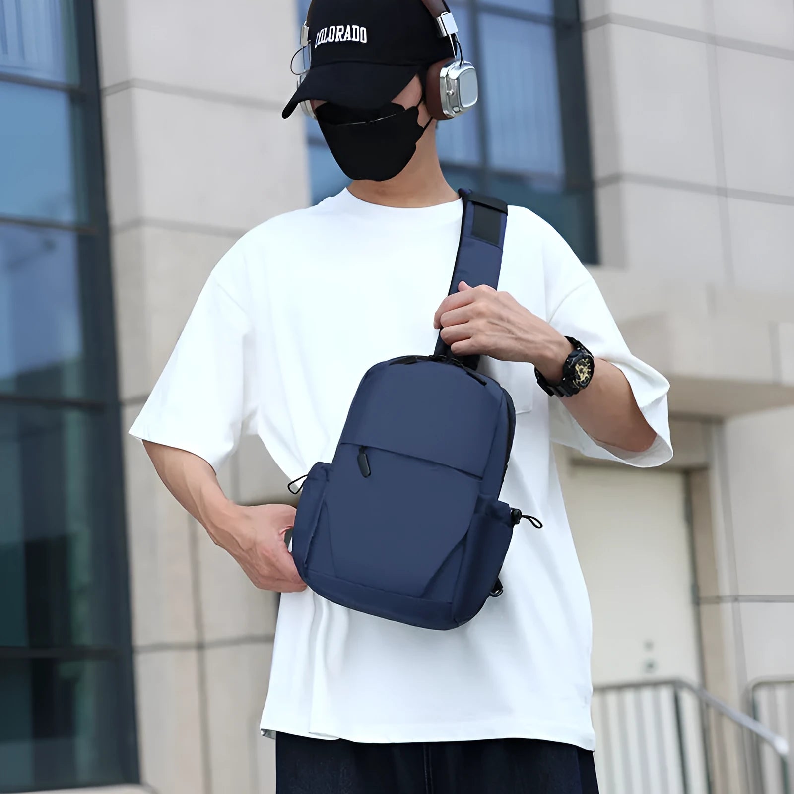 Grey waterproof polyester chest bag with shoulder strap showing 33cm height and 20cm width dimensions