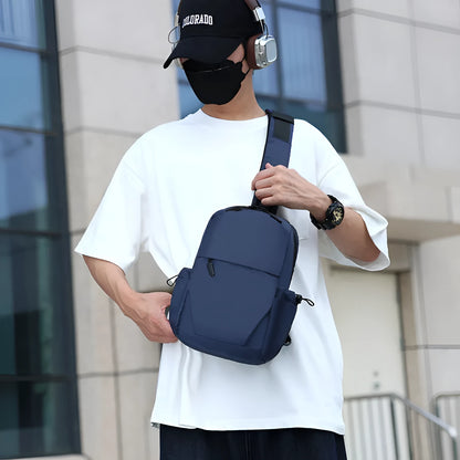 Grey waterproof polyester chest bag with shoulder strap showing 33cm height and 20cm width dimensions