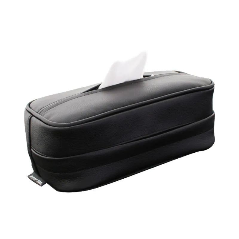 Black leather hanging storage box with PU coating, dimensions 23x13x9cm, shown behind a car headrest