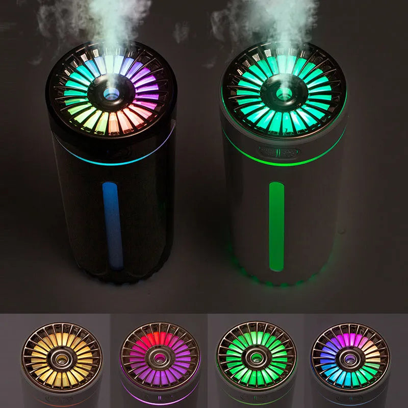 Black wireless car humidifier with colourful LED lights shown in vehicle cup holder