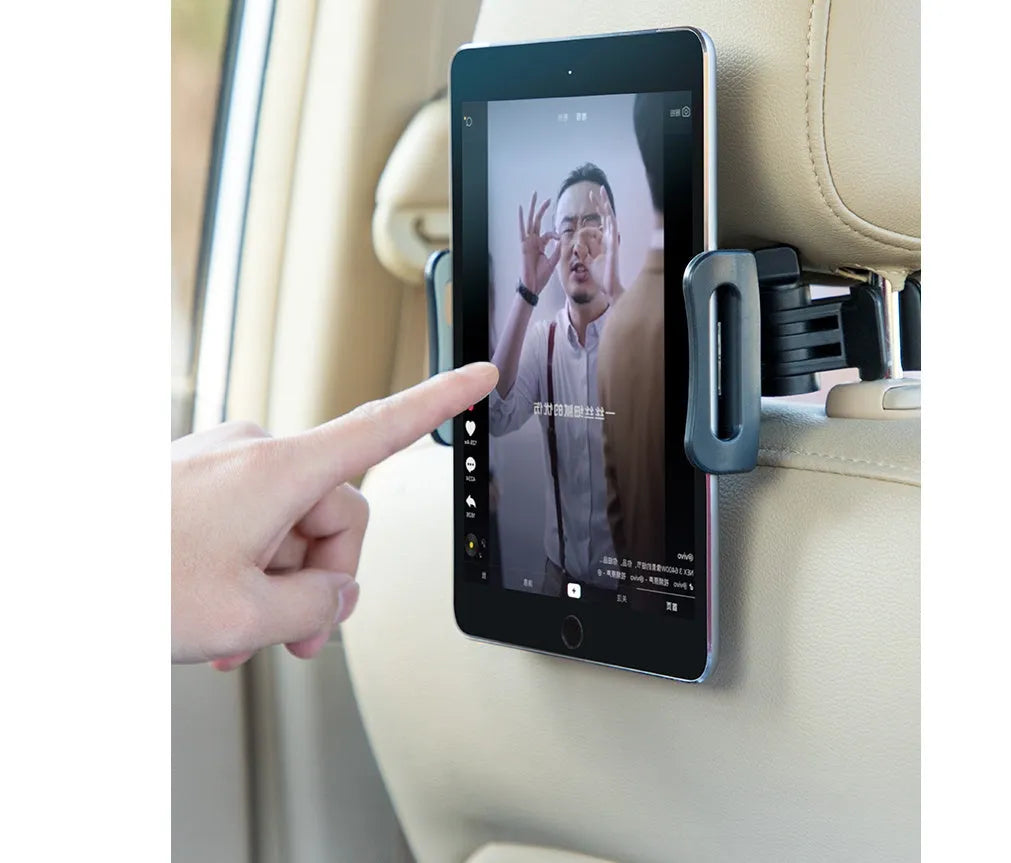 Black car tablet holder mounted on vehicle rear seat base holding iPad