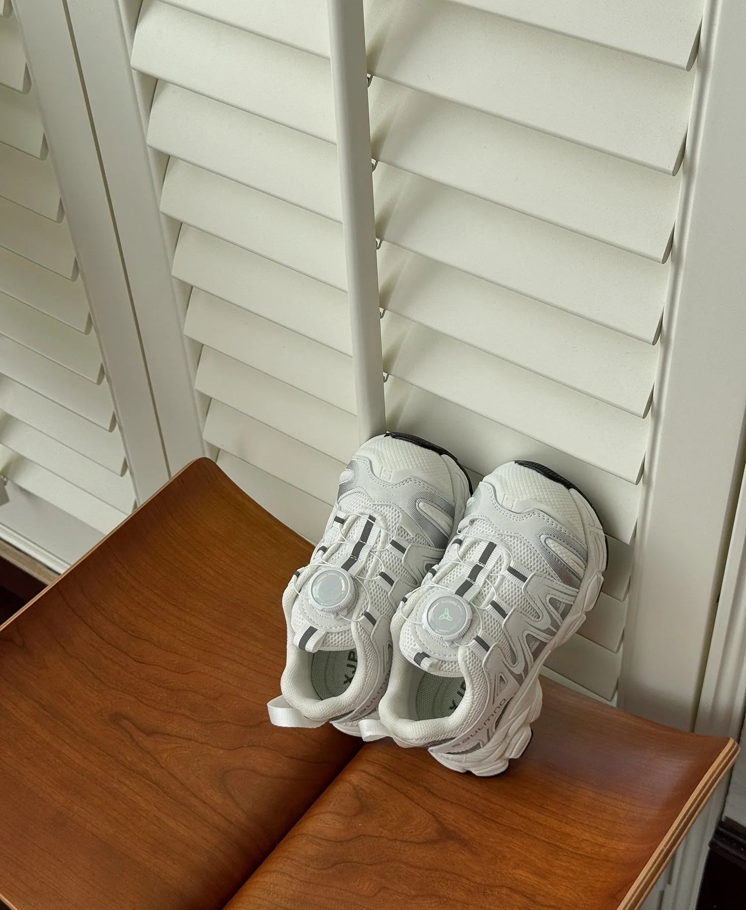 Pair of solid-colour casual shoes with a PU leather mesh upper, shown in beige.