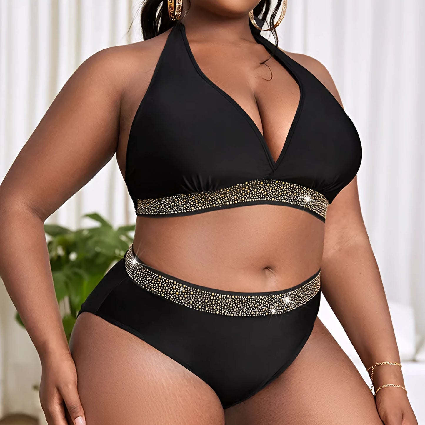 Black plus size women's bikini set on a mannequin, showing the bra and shorts.