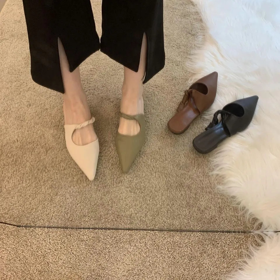 Women's soft leather slippers with semi-toe box in black, khaki, cream-white, and dark brown colours on a rubber sole.