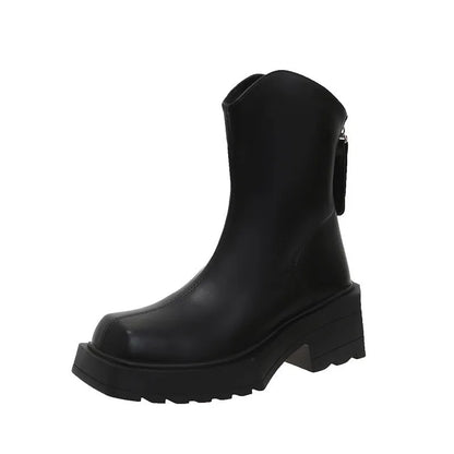 Women's black platform Martin ankle boots with square toe and back zip on a white background.