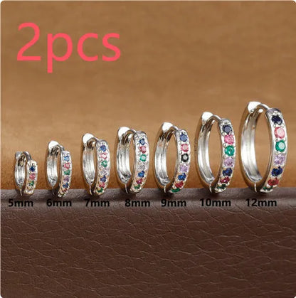Circle zircon perforated stud earrings in gold, rose gold, silver colours with geometric design and multiple size options