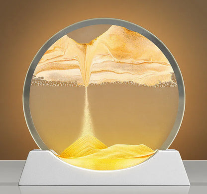 A rotary abstract night lamp with coloured sand falling inside clear glass, showing blue variant.